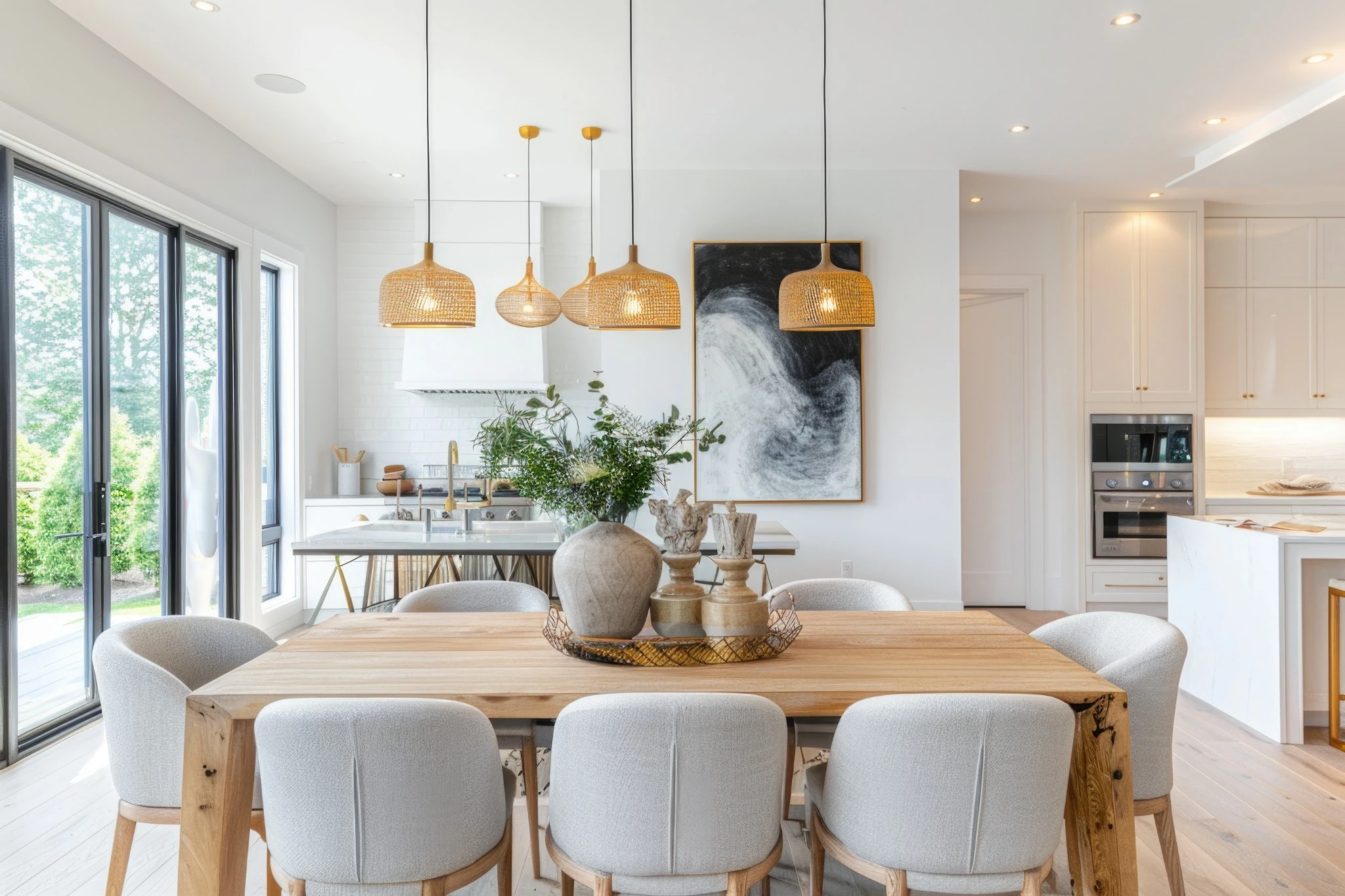 A bright dining space with natural wood furniture and a welcoming kitchen